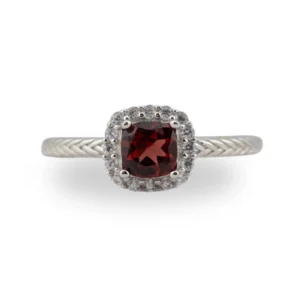 Faceted natural Garnet gemstone centrepiece Surrounded by diamond-cut cubic zirconia
