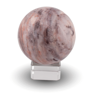 Peach agate sphere on glass stand