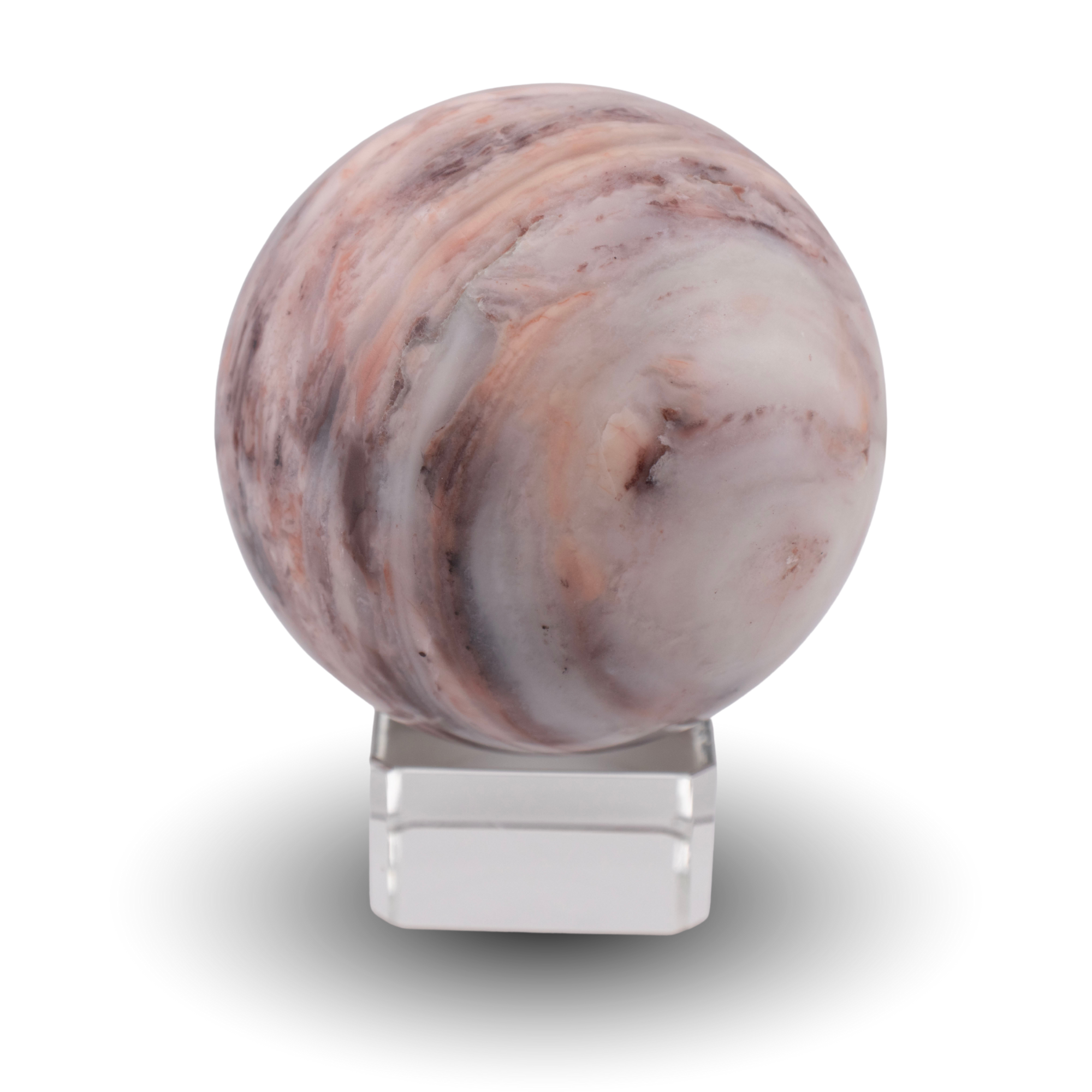 Peach agate sphere on glass stand