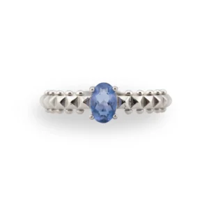 a faceted oval fluorite set in a detailed 925 sterling silver band