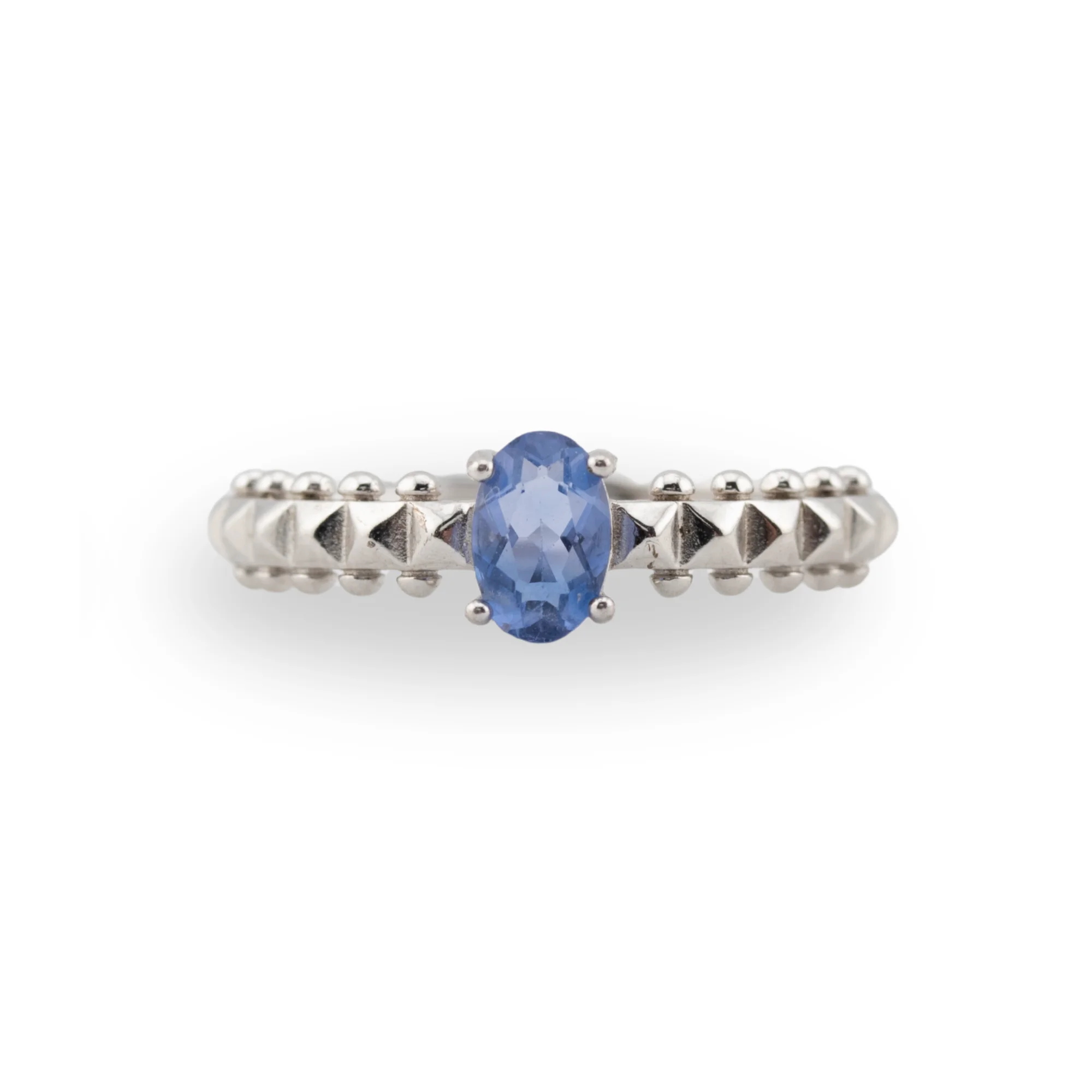 a faceted oval fluorite set in a detailed 925 sterling silver band