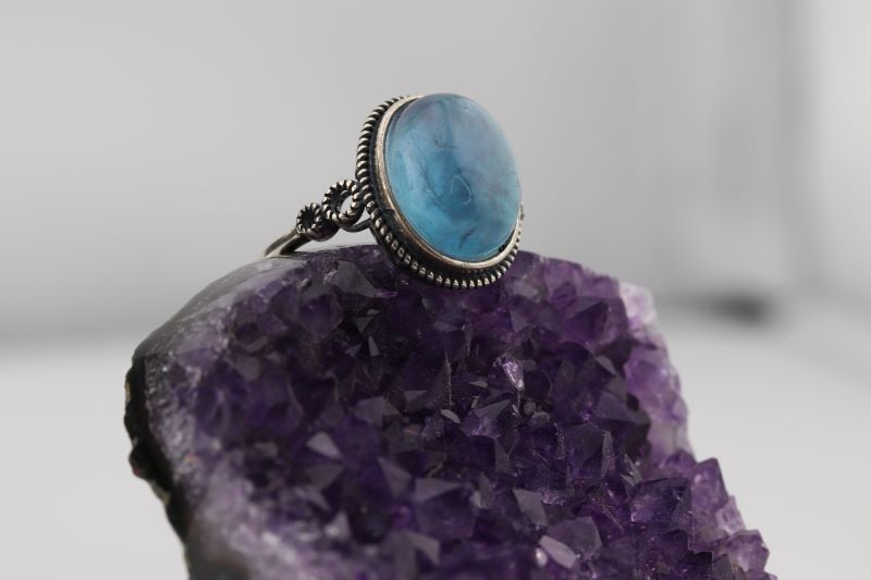 aquamarine ring on raw amethyst crystal