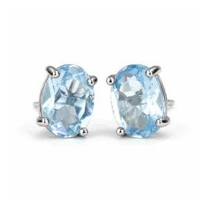 Pair of oval Aquamarine stud earrings set in polished 925 sterling silver on a white background.