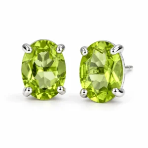 Oval peridot stud earrings in 925 sterling silver with faceted bright green gemstones on a plain white background.